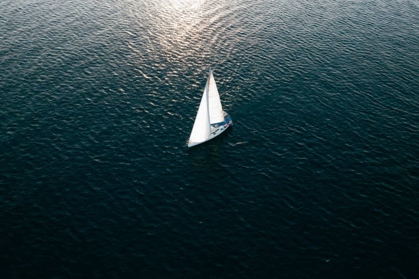 istock Aerial View Sailboat Moving on the Sea 1437537972