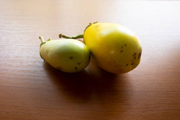 The yellow eggplant placed on the table is brown
