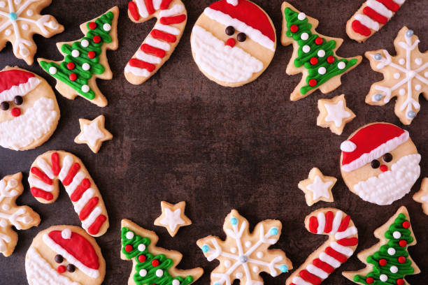 istock Cute Christmas cookie frame on a dark stone background 1437539311
