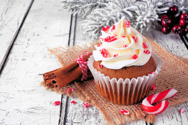 istock Christmas candy cane cupcake with creamy frosting 1437539404