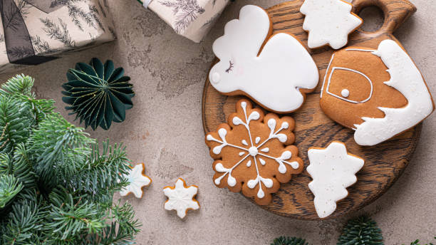 istock Gingerbread cookies on light background. Star shaped spicy biscuits. Christmas cooking background. Top view food. 1437545221