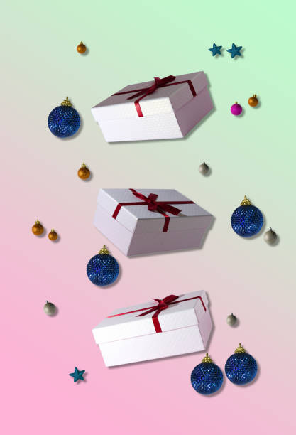istock three gift boxes surrounded by christmas decorations, creative holiday concept, on the pastel background 1437547261