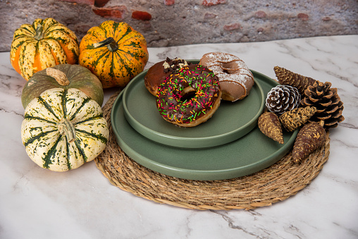 Halloween Pumpkins and Colorful Donuts