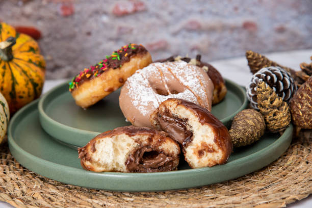 istock Halloween Pumpkins and Colorful Donuts 1437547524