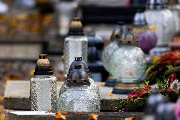 istock Candles on graves in the cemetery during the All Saint's Day. 1437547567