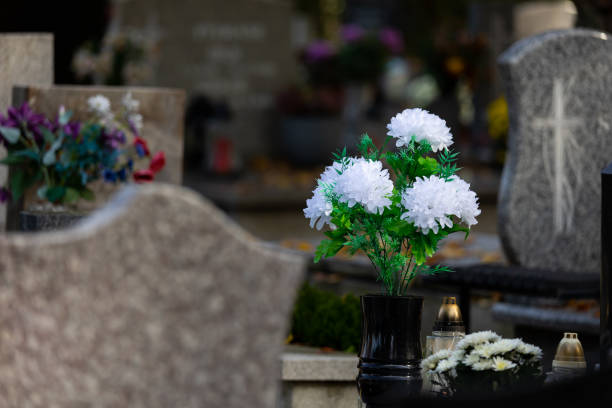 istock Flowers on graves in the cemetery during the All Saint's Day. 1437548038