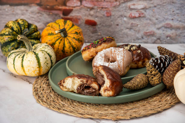 istock Halloween Pumpkins and Colorful Donuts 1437548434