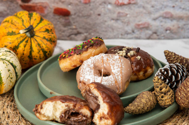 istock Halloween Pumpkins and Colorful Donuts 1437548435