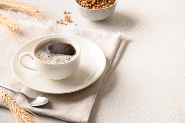 istock Barley coffee in white cup and ears of barley on white background. 1437551244