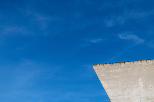 istock Modern concrete building against a blue sky background 1437555456