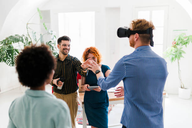istock Business team presenting new project to a client on a virtual reality simulator. 1437556378
