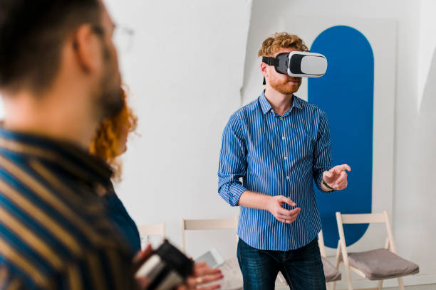 istock Business team presenting new project to a client on a virtual reality simulator. 1437556601