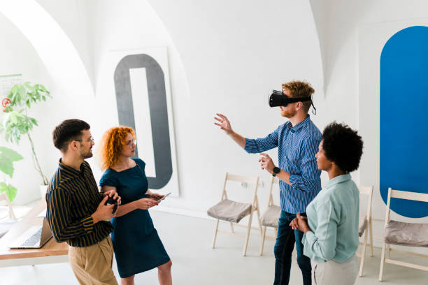 istock Business team presenting new project to a client on a virtual reality simulator. 1437556645