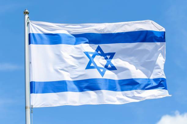 istock Israel national flag on a sunny day 1437558386