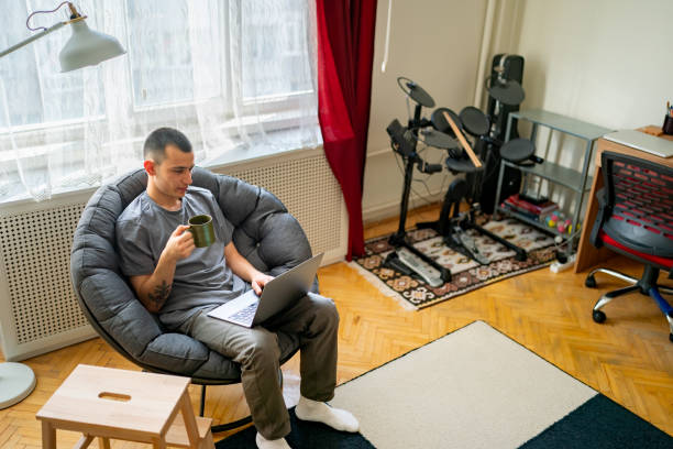 istock Adult student working at home with laptop 1437558535