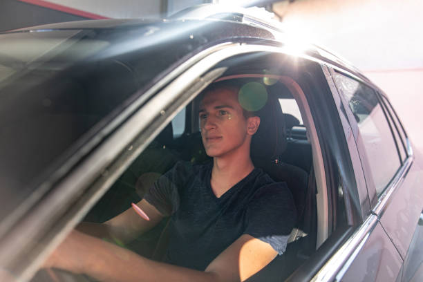 istock Teenage Driver in His Car 1437559341