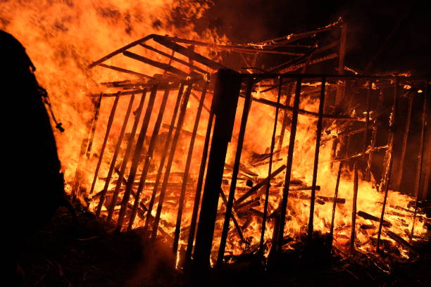 istock Wooden rural house is burning in fire at night 1437560900