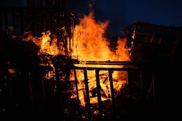 istock Wooden rural house is burning in fire at night 1437560912