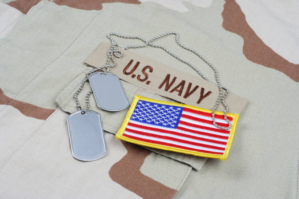 istock US NAVY branch tape with dog tags on desert camouflage uniform 1437571141