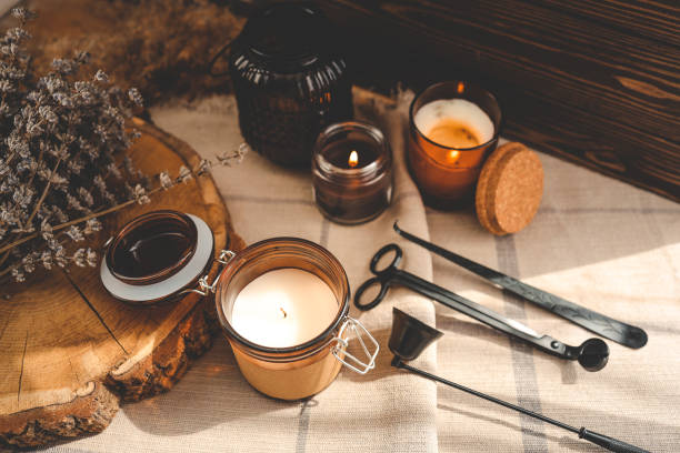 Burning candles and accessories for them, atmospheric photo