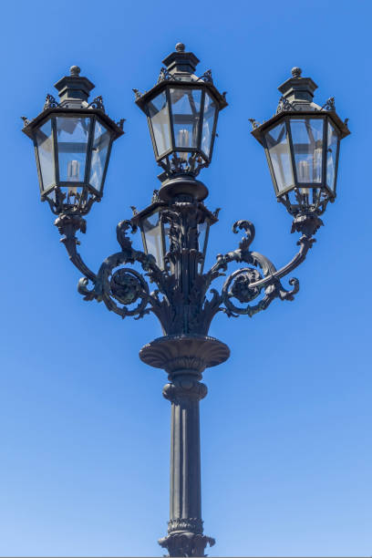istock vintage street lamp on a blue sky background 1437576932