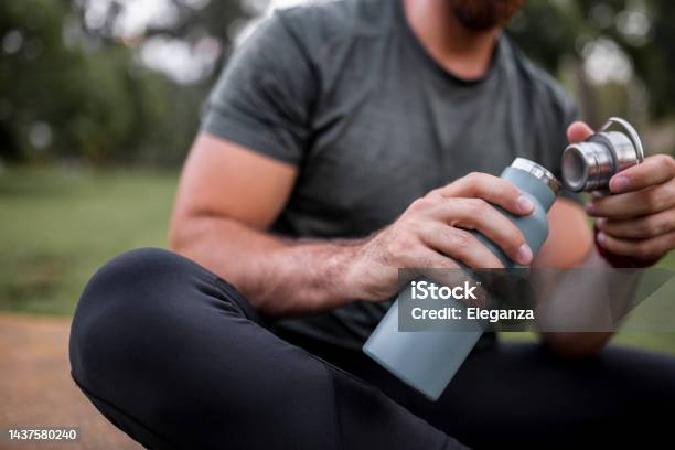 Close Up Of A Reusable Water Bottle In A Human Hand Concept Of Thirst Rehydration And Decreasing Single Use Plastic Stock Photo - Download Image Now