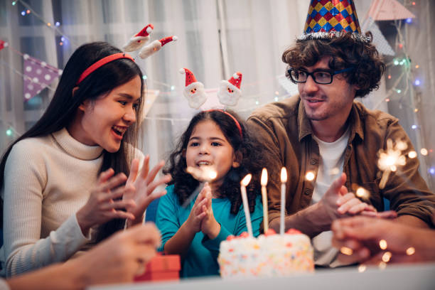 istock Happy family celebrating birthday together. 1437584572