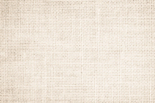 istock Jute hessian sackcloth burlap woven, linen texture pattern background in light beige cream brown color blank. Natural weaving canvas fiber line cotton cloth textured as clean organic for decoration. 1437584660