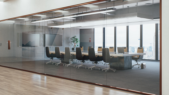 Interior of an empty modern meeting room with cityscape view.