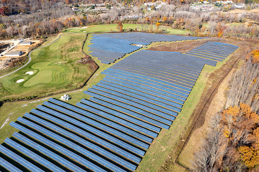 Solar panel field in New Jersey using photovoltaics, am alternative electricity source - concept of sustainable power.