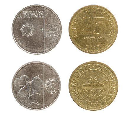 Close up of the new and old 25 Sentimo Philippines coin isolated on a white background