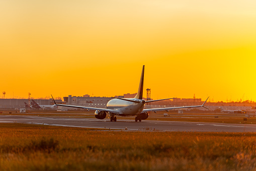 A plane of Air Canada is preparing to take off in Pearson International airport at dusk, Toronto,Canada.