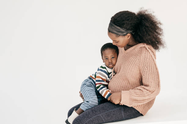 Pregnant mother playing with toddler son