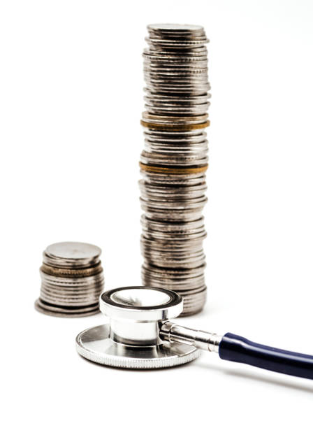 Indian coins and stethoscope stock photo