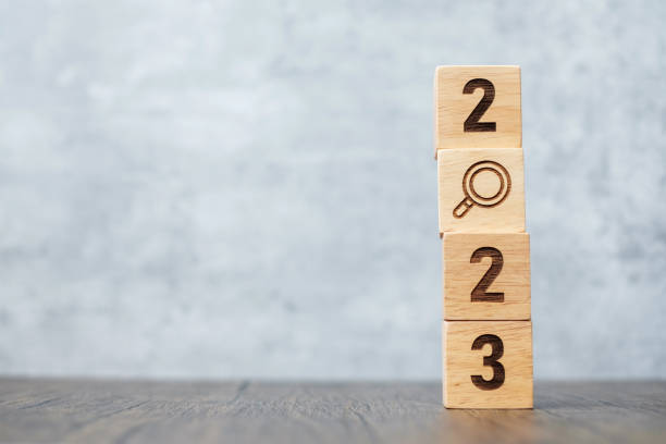 istock 2023 block with magnifying glass icon. SEO, Search Engine Optimization, hiring , Advertising, Idea, Strategy, marketing, Keyword, Content and New Year start concepts 1437617653