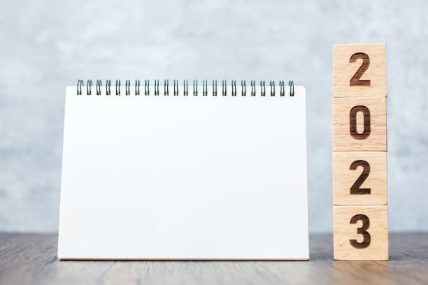 istock 2023 Happy New Year with blank notebook and wooden number. countdown, Resolution, Goals, Plan, Action and Mission Concept 1437617684