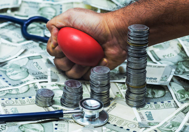 Indian currency, Indian coins, stethoscope and stress ball stock photo