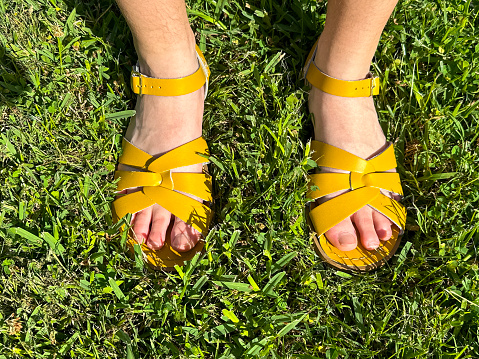 Girls Feet With Yellow Sandals