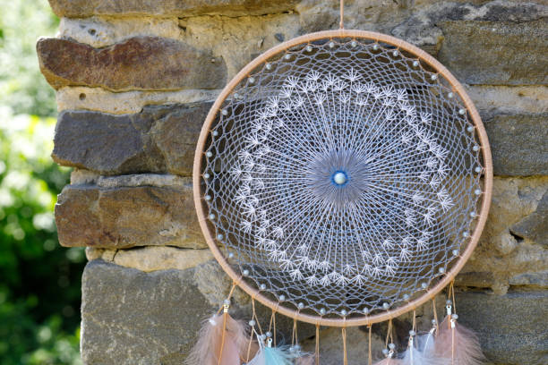 istock Handmade dream catcher with feathers threads and beads rope hanging 1437623932