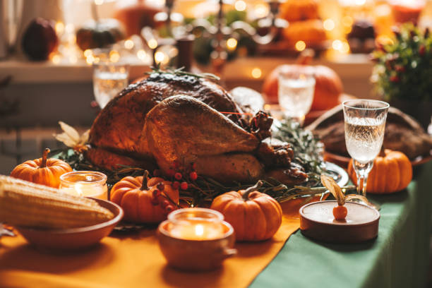 istock Thanksgiving holiday dinner table setting with fall decoration and pumpkins 1437626359