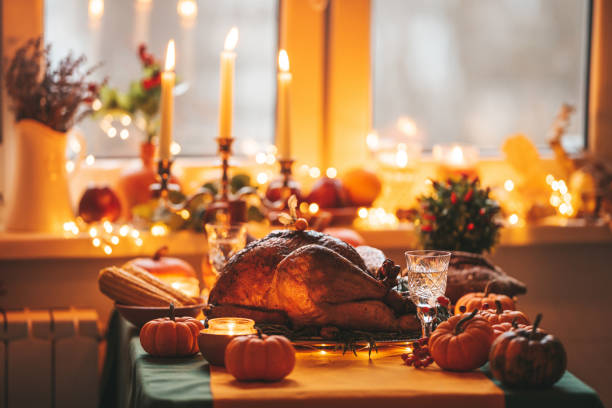 istock Thanksgiving holiday dinner table setting with fall decoration and pumpkins 1437626366