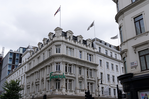 Fenwick store at City of London on a cloudy summer day. Photo taken August 3rd, 2022, London, United Kingdom.