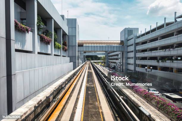 Electric Skytrain Airport Link For Passenger Arrival To The Next Airport With Running Through The Outside And Parking Building Stock Photo - Download Image Now