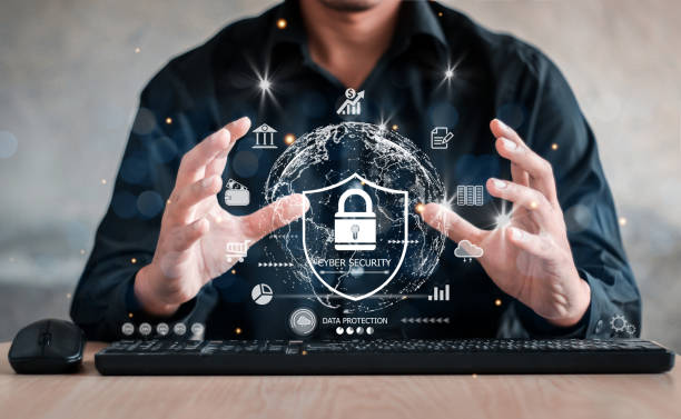 istock Businessman holding shield protect icon. Protection network security computer and safe your data concept, lock symbol, concept about security, cybersecurity and protection against dangers. 1437631284