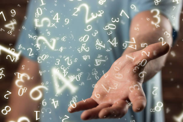istock numerology, young man holds out his hand, surrounded by numbers 1437632510