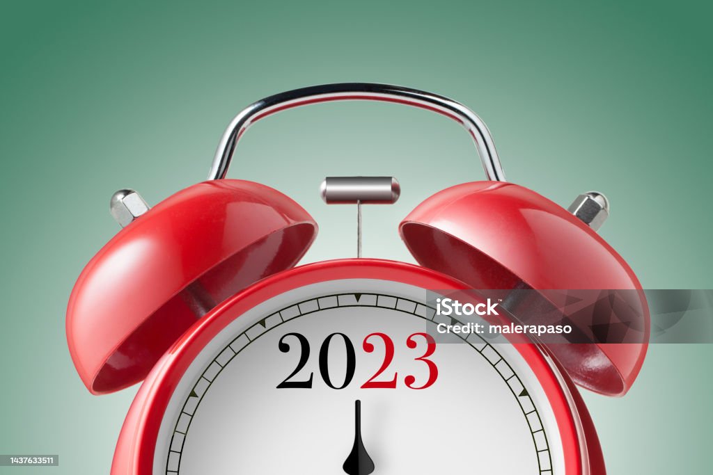 New Year 2023. Close up view of a red alarm clock. Alarm Clock Stock Photo