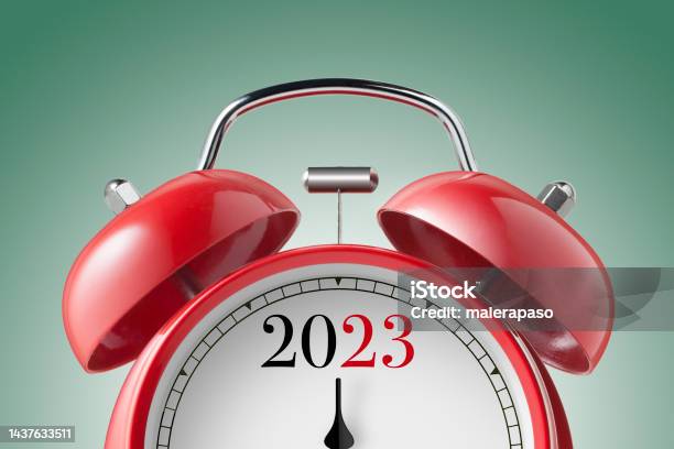 New Year 2023 Close Up View Of A Red Alarm Clock Stock Photo - Download Image Now - Alarm Clock, Clock, 2023
