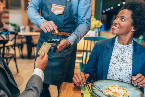 istock Businessman paying with credit card 1437633734