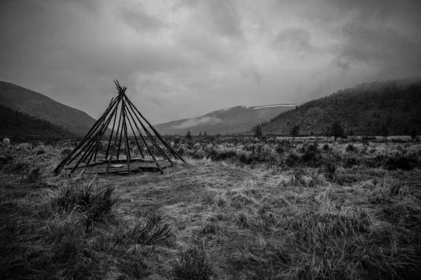 istock Grayscale shot of a nomadic tribe teepee structure on a rural field in Mongolia 1437638619