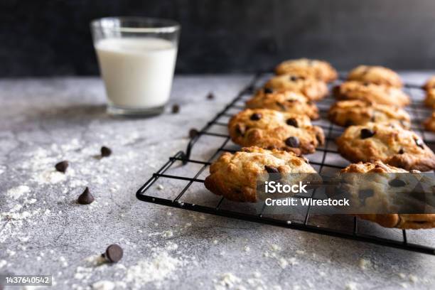 Chocolate Chip Cookies On A Cooling Rack With A Glass Of Milk Stock Photo - Download Image Now